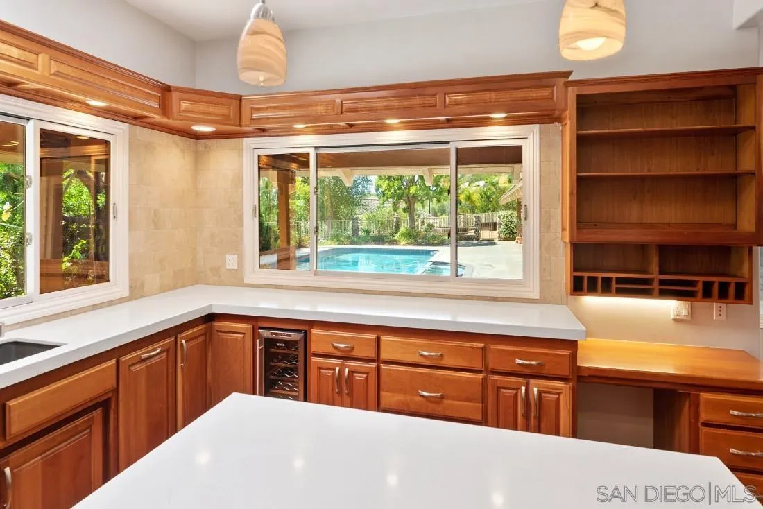 13260 Glen Circle Road Poway, CA 92064 - Photo 18 of 53 a kitchen with a window a sink and a counter