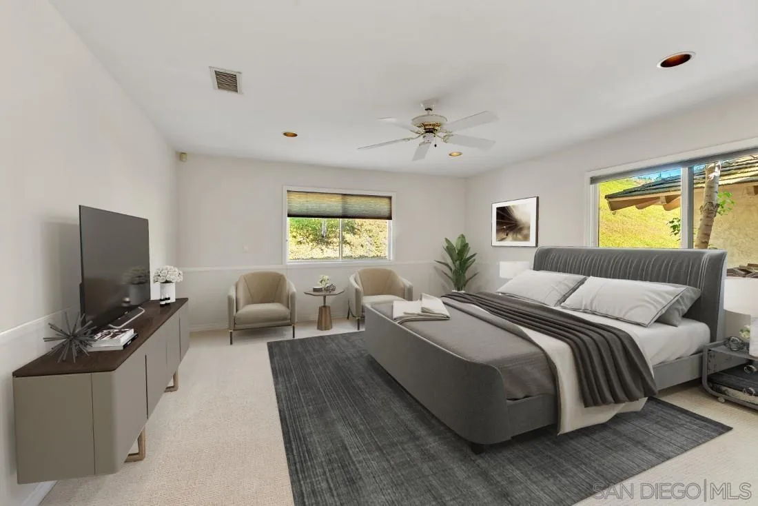 13260 Glen Circle Road Poway, CA 92064 - Photo 23 of 53 a bedroom with a large bed and a flat screen tv