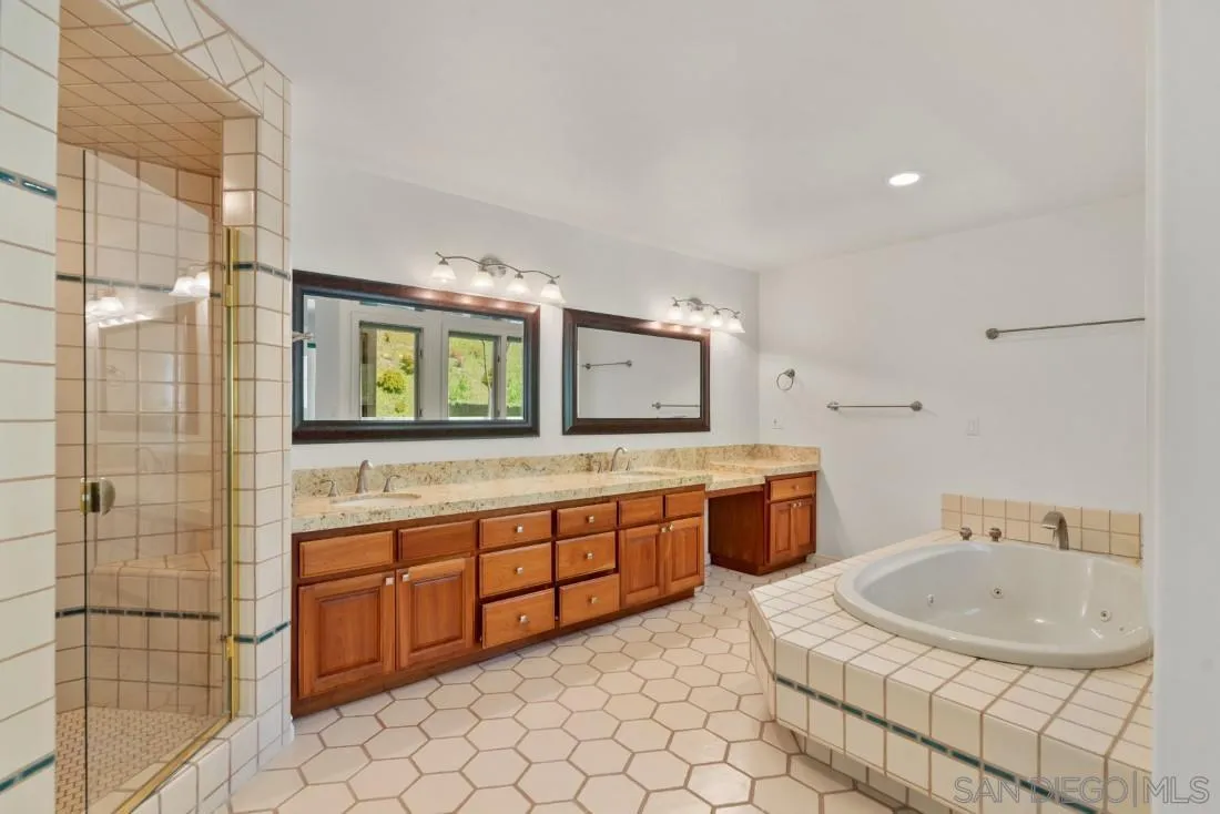 13260 Glen Circle Road Poway, CA 92064 - Photo 39 of 53 a bathroom with a sink and a large mirror