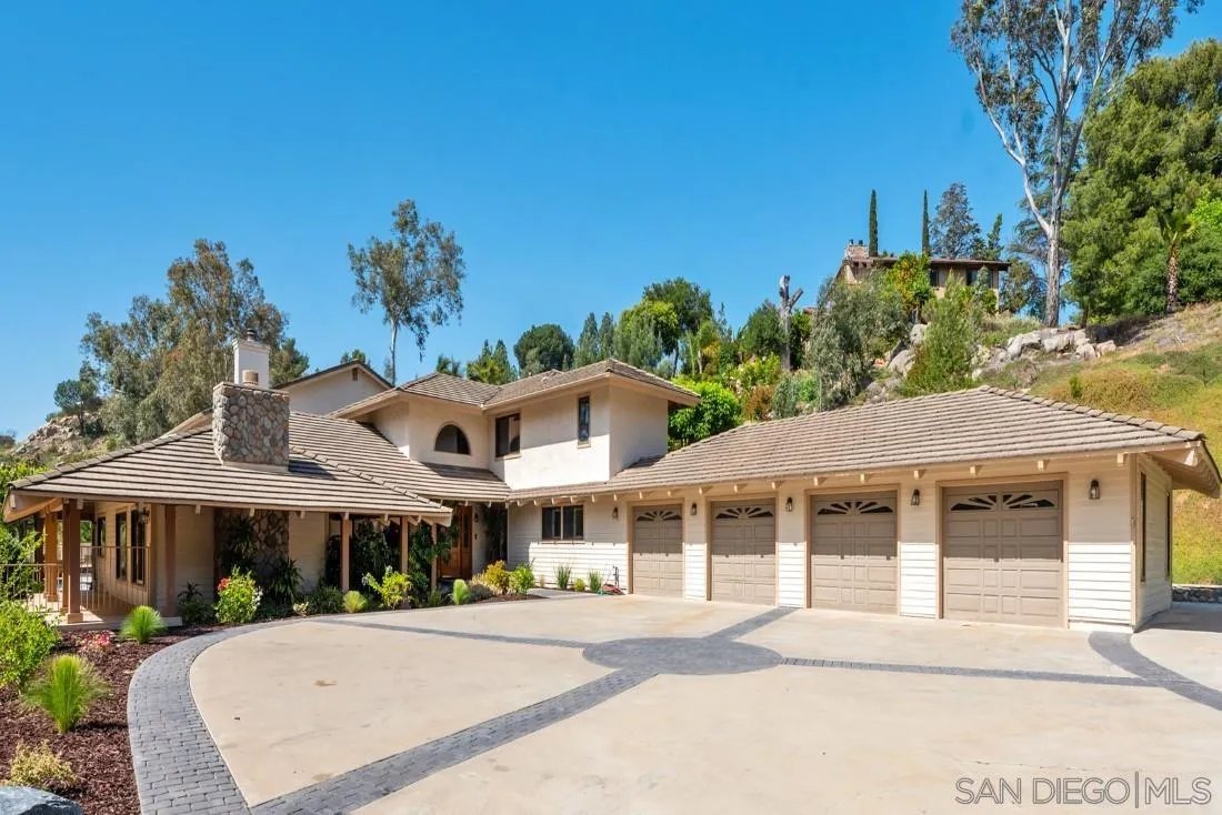 13260 Glen Circle Road Poway, CA 92064 - Photo 49 of 53 a front view of a house with a yard and garage