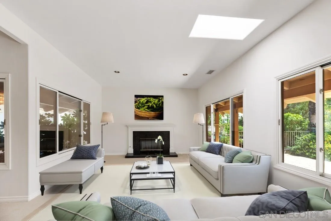 13260 Glen Circle Road Poway, CA 92064 - Photo 7 of 53 a living room with furniture a large window and a fireplace