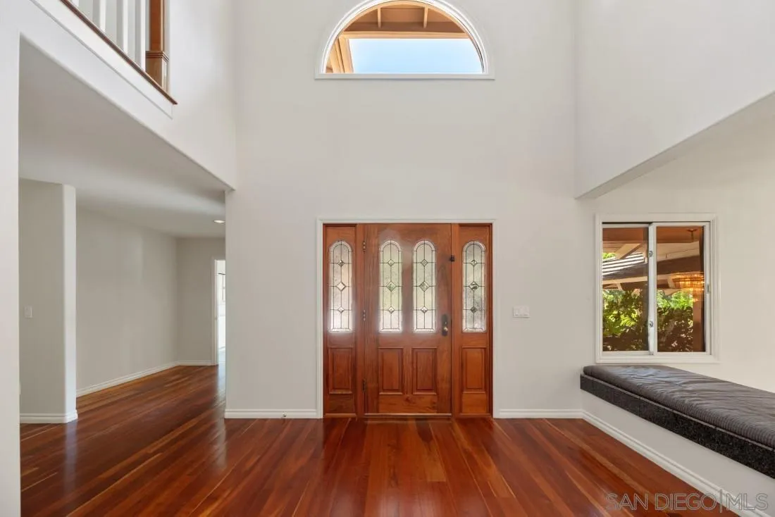13260 Glen Circle Road Poway, CA 92064 - Photo 8 of 53 an empty room with wooden floor and windows