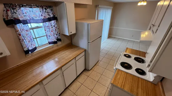 a view of a kitchen from a living room