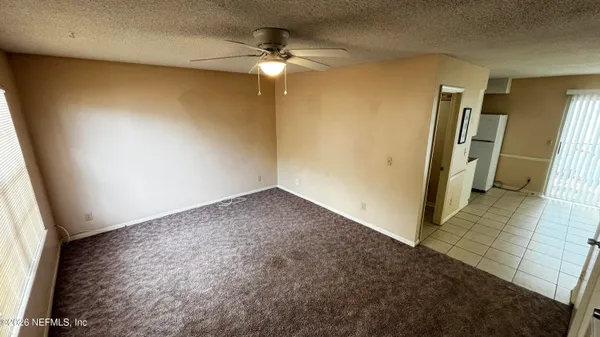 an empty room with a fireplace