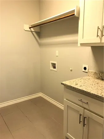a bathroom with a granite countertop sink and vanity