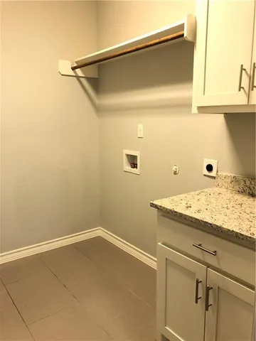 a bathroom with a granite countertop sink and vanity
