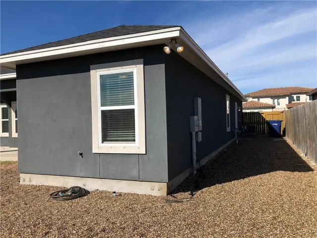 a view of backyard with a outdoor space