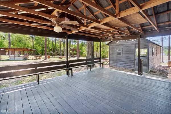 a sitting area with wooden walls