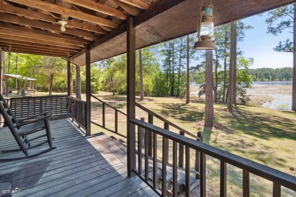 a view of a balcony with wooden floor
