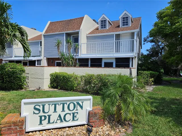 a view of a wooden house with a yard