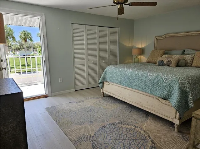 a bedroom with a bed next to a window