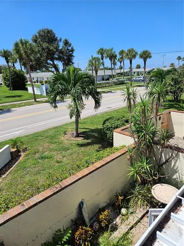a bedroom with two beds and painting on the wall
