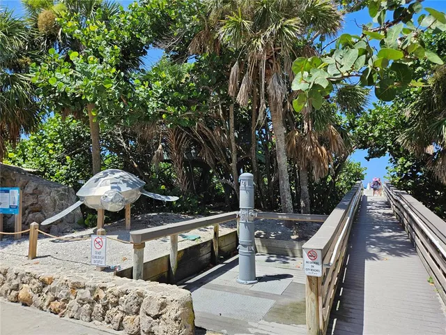 a view of balcony with wooden floor and fence