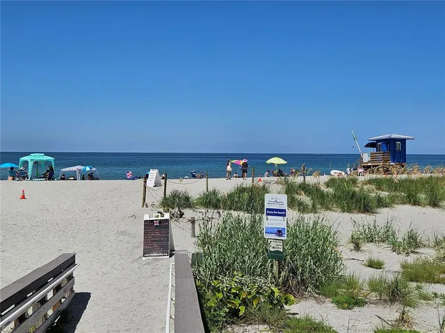 a view of a backyard with plants and a garden