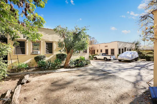 a view of a car park in front of house