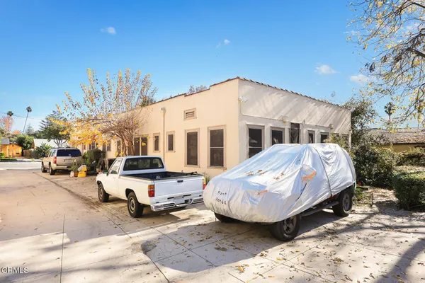 a view of a house with snow on the road