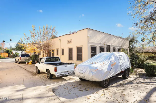 a view of a house with snow on the road