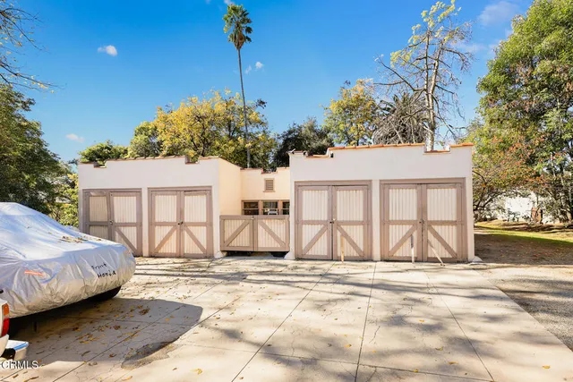 a swimming pool with outdoor seating and yard