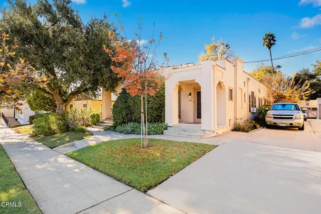 a front view of a house with a yard