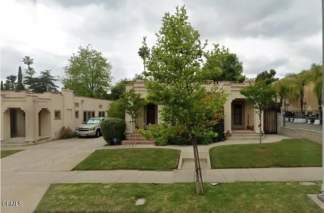 an aerial view of a house with a garden