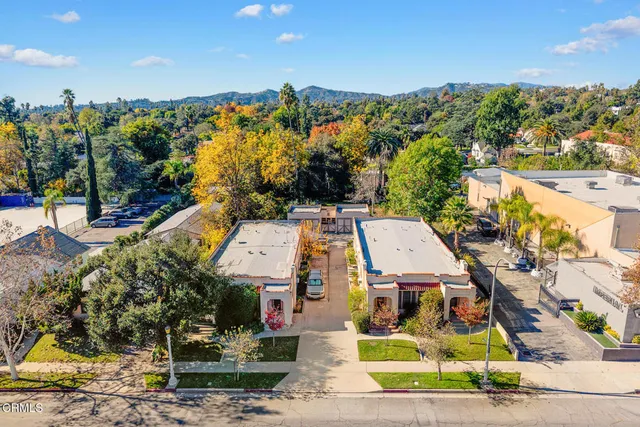 a front view of a building with garden