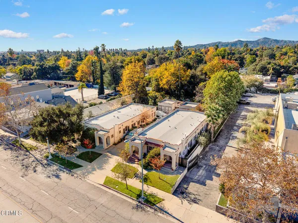 an aerial view of residential houses with outdoor space