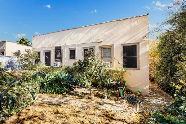 an aerial view of a house with a swimming pool