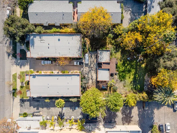 an aerial view of residential houses with outdoor space