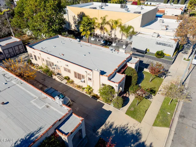 an aerial view of a house with outdoor space
