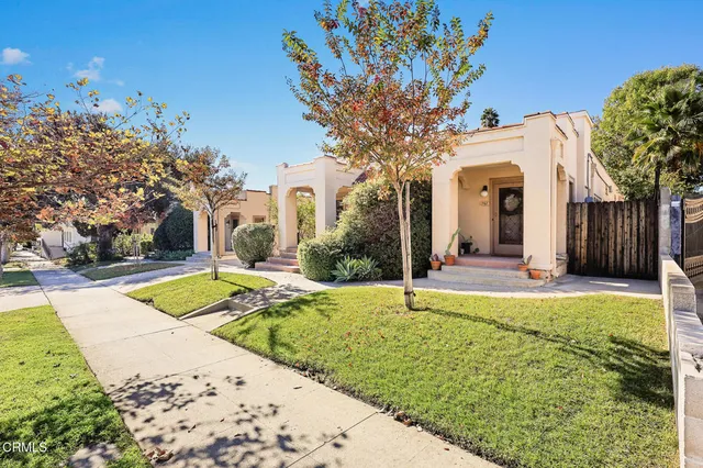 a view of a house with a street