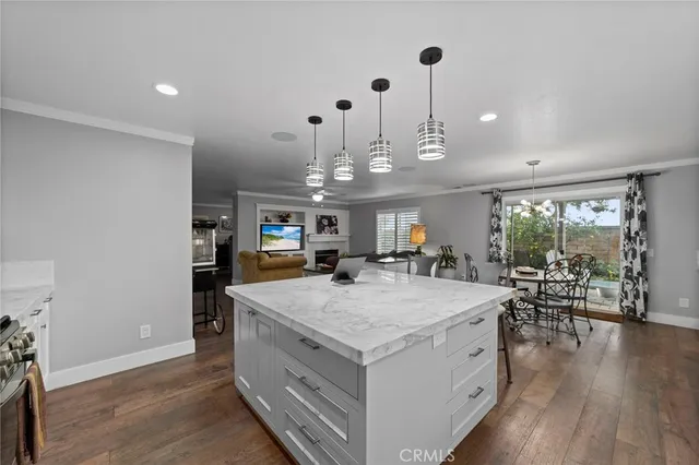 a view of a dining hall with furniture and wooden floor