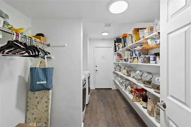 a room with lots of books and a book shelf