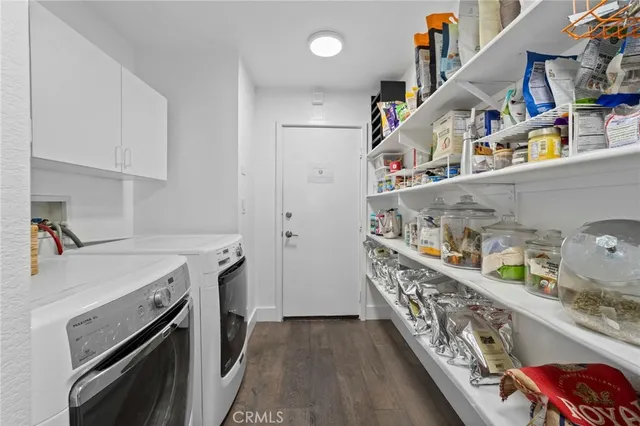a kitchen with storage and utility