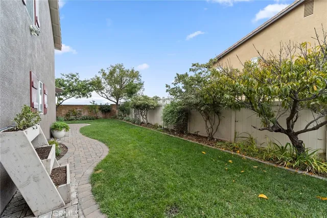 a view of yard with patio