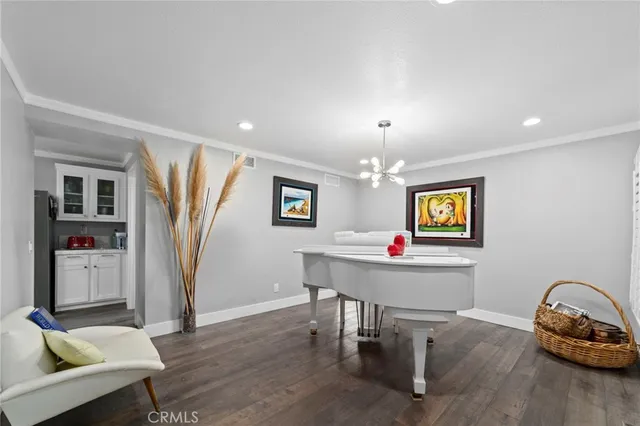 a room with furniture and a wooden floor