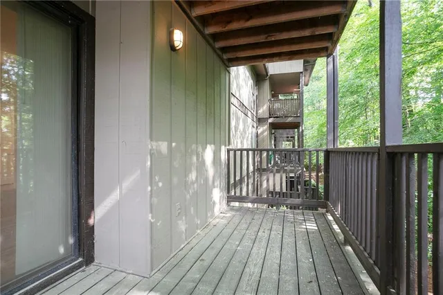 a view of a balcony with wooden floor