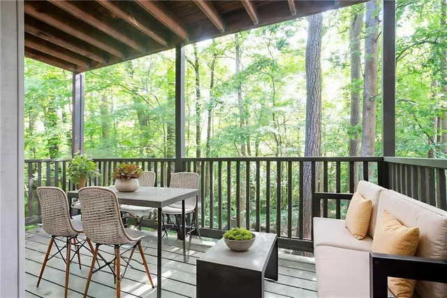 a view of a patio with a table and chairs