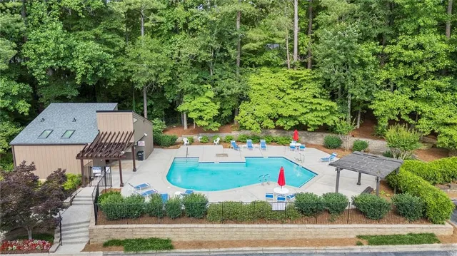 an aerial view of a house with yard and outdoor seating
