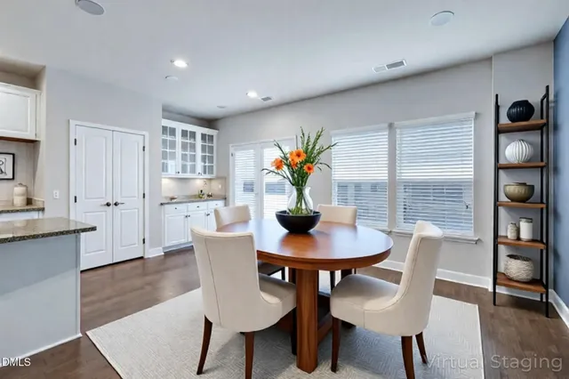 a view of a dining room with furniture and window