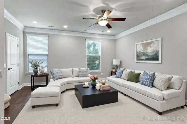 a dining room with furniture and chandelier