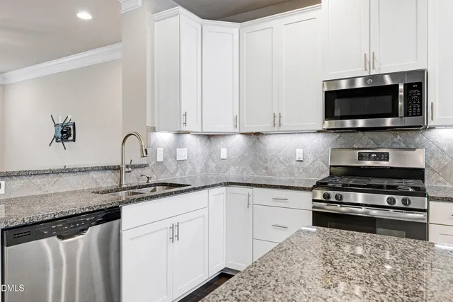 a spacious bedroom with a bed and a large window