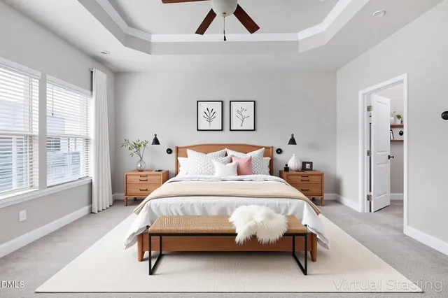 a bathroom with a granite countertop sink mirror vanity and toilet