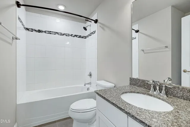 wooden floor with a bathroom