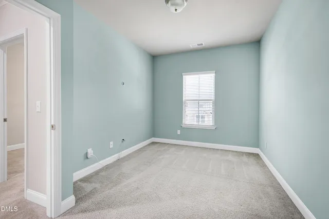 a view of a chairs and tables in the balcony