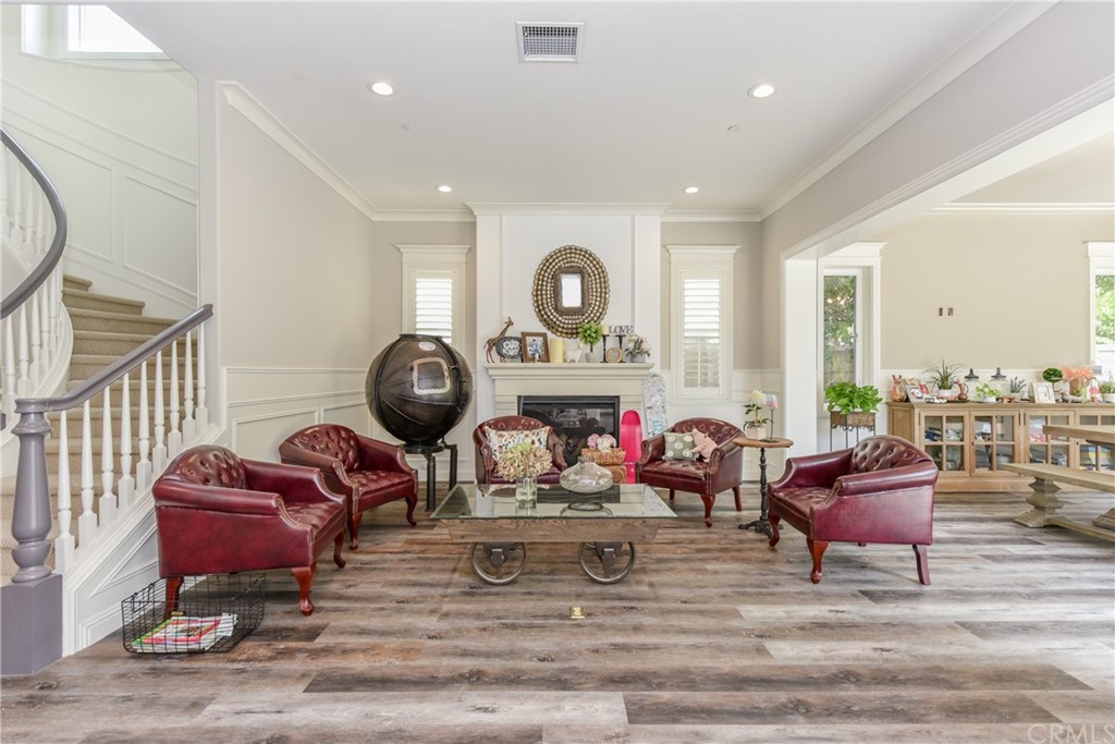 18 Tomango Lake Forest, CA 92630 - Photo 11 of 45 a room with furniture a mirror and wooden floor