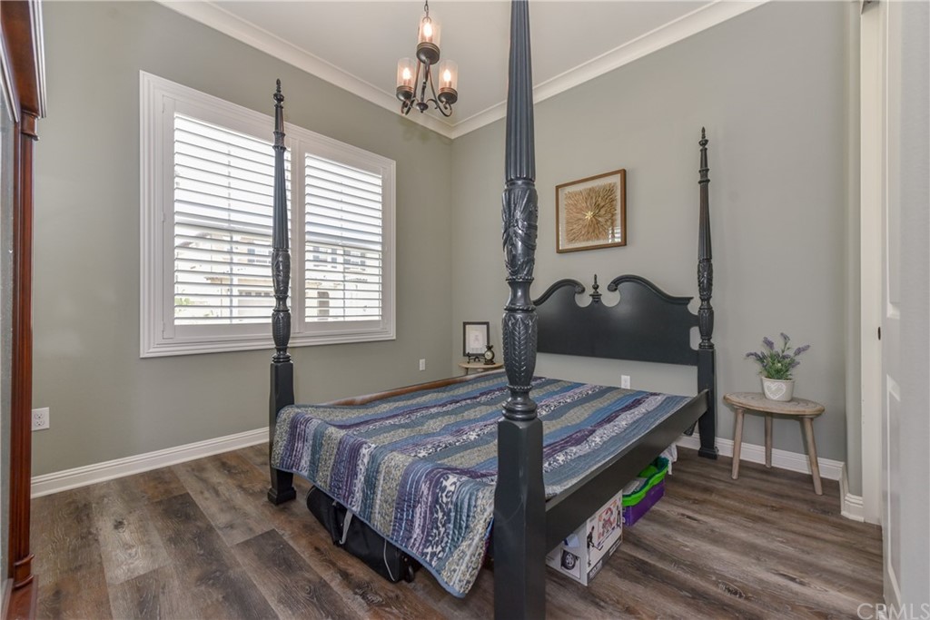 18 Tomango Lake Forest, CA 92630 - Photo 16 of 45 a bedroom with a bed and wooden floor