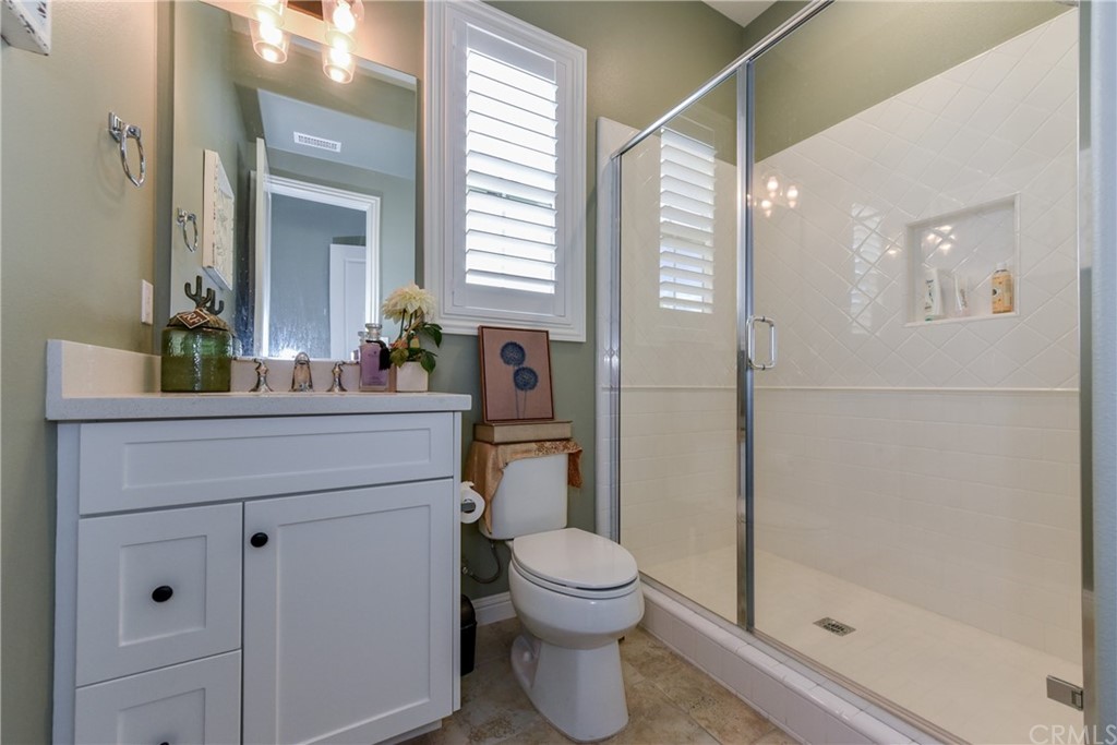 18 Tomango Lake Forest, CA 92630 - Photo 17 of 45 a bathroom with a sink a toilet and shower