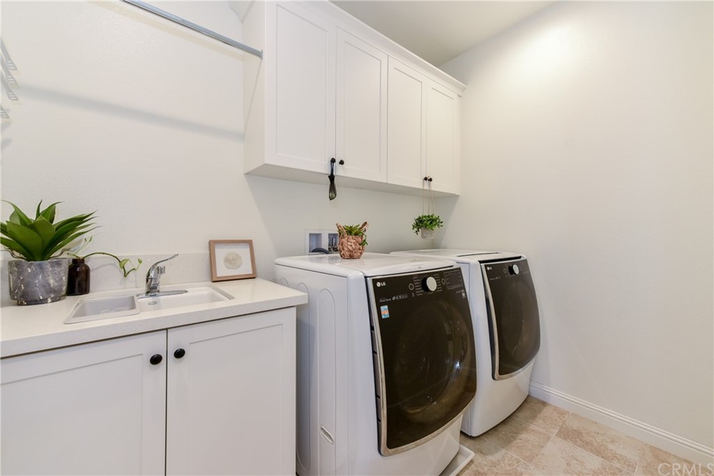 18 Tomango Lake Forest, CA 92630 - Photo 18 of 45 a utility room with sink dryer and washer