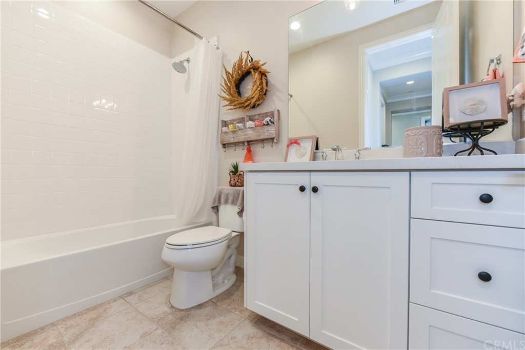 18 Tomango Lake Forest, CA 92630 - Photo 19 of 45 a bathroom with a sink a toilet and mirror