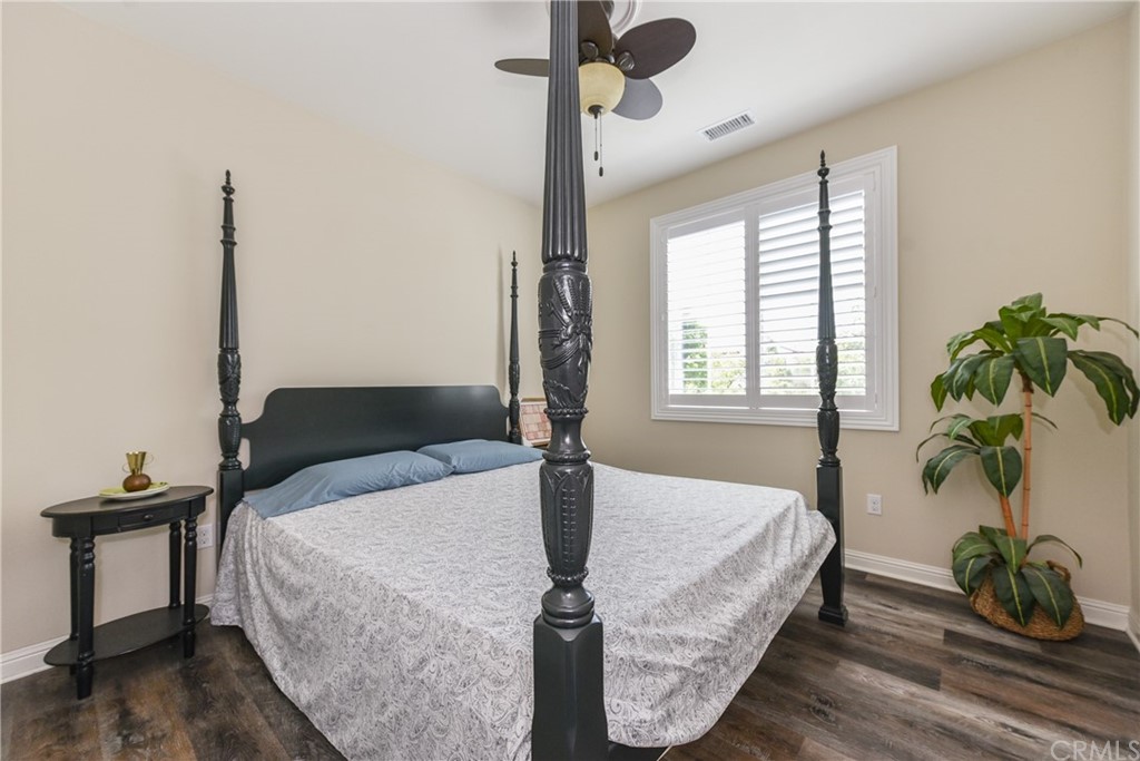 18 Tomango Lake Forest, CA 92630 - Photo 20 of 45 a bed sitting in a bedroom next to a window with potted plant